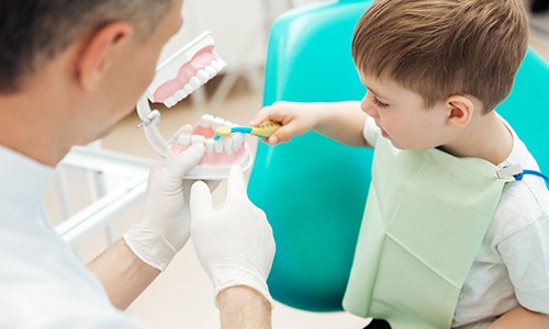 Dental hygienist in Big Pine Key performing a cleaning on a young child 