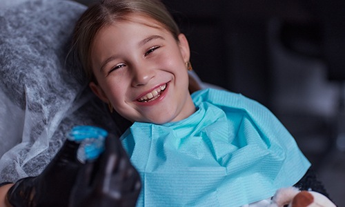 Child receiving a fluoride treatment at a Big Pine Key dental office 