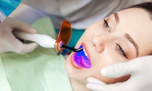 Woman receiving dental bonding treatment