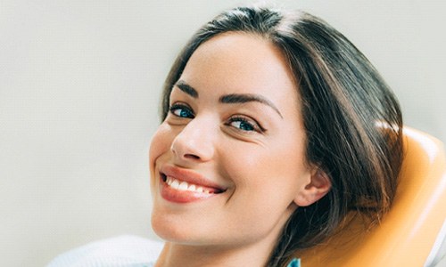 A smiling woman about to receive cosmetic dentistry