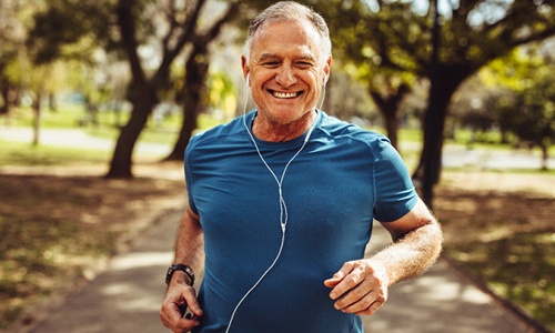 Older man with dental implants in Big Pine Key running