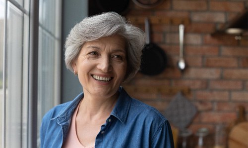 Senior woman smiling with dentures