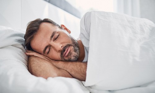 Man sleeping in bed