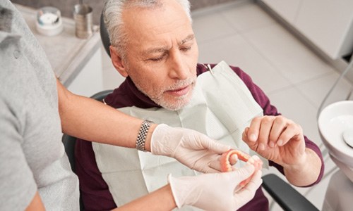 Man at the dentist with dentures