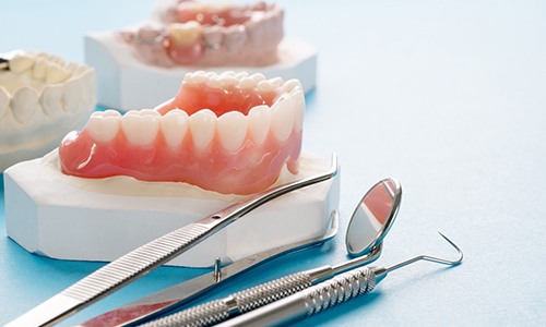 A closeup of upper and lower removable dentures