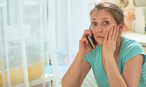 Woman calling a Big Pine Keys emergency dentist