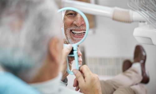 Older man visiting an implant dentist in Big Pine Key