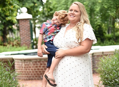 Doctor Cobb and her youngest child outdoors