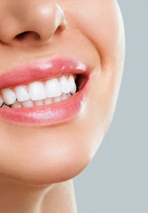Nose-to-neck closeup of someone’s flawless smile