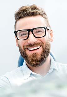Smiling man in dental chair