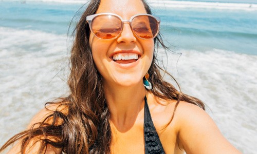 middle-aged woman smiling on beach in Big Pine Key