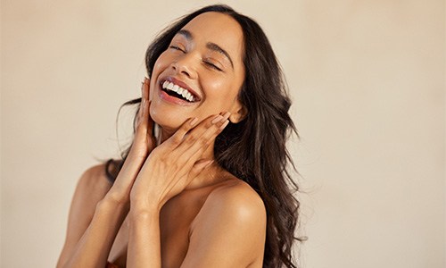 Portrait of smiling woman with beautiful skin
