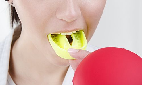 Closeup of patient with mouthguard to prevent dental emergencies in Big Pine Key