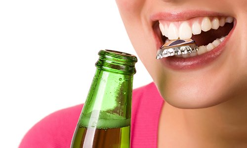Woman with bottlecap in her mouth headed for dental emergency in Big Pine Key