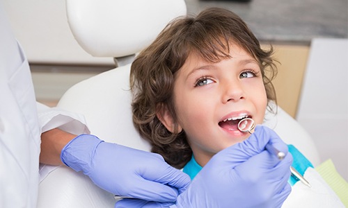 Child receiving dental exam