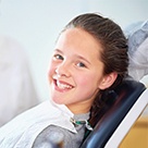 Smiling child in dental chair