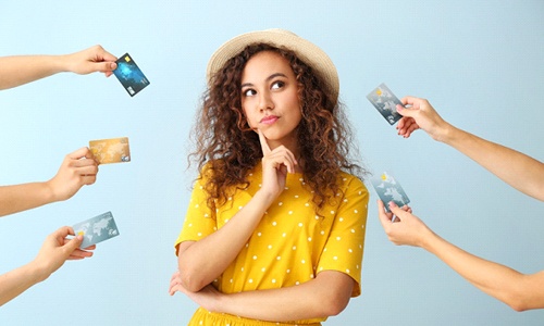 Woman surrounded by credit cards