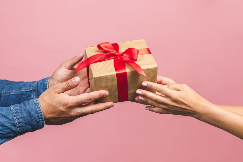 person giving teeth whitening as a gift